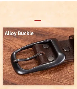 Close-up of alloy buckle on vintage brown leather belt with metal rivets and rustic texture