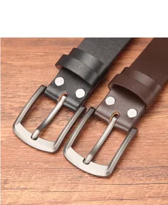 Detail view of leather belts with silver matte pin buckles in black and dark brown