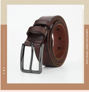 Close-up of retro leather belt texture with a dark grey alloy pin buckle and stitching