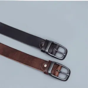 Close-up of matte metal pin buckles and grainy texture on genuine leather belts