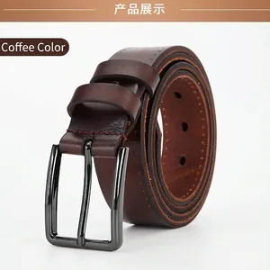 Macro shot of coffee brown leather belt with gunmetal alloy buckle and durable stitching