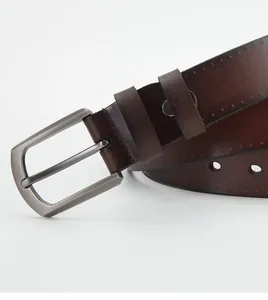 Close-up of a dark brown genuine leather belt with a brushed metal pin buckle detail