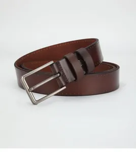 Close-up of men's leather belt featuring a matte grey metal buckle and contrast stitching