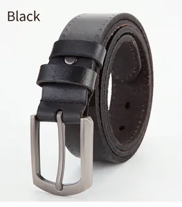Detail of black genuine leather belt featuring a matte metal pin buckle and stitching