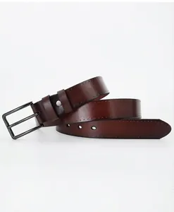 Close-up of vintage brown leather belt with black matte metal buckle and stitched edges