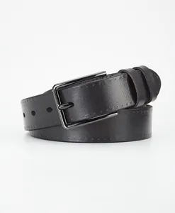 Close-up of dark brown leather belt featuring double stitching and a black metal buckle