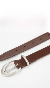Detail of a brown frosted genuine leather belt with a silver metallic round pin buckle