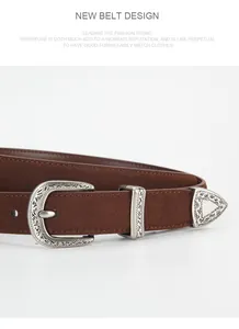 Detail of vintage brown belt with engraved silver buckle and bohemian floral patterns