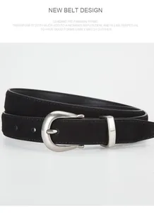 Close-up of black suede leather belt with silver horseshoe pin buckle for women