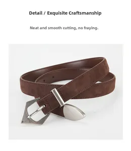Close-up of matte brown suede belt featuring a vintage geometric silver buckle