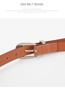 Detail of a brown leather belt with silver oval buckle and white contrast stitching