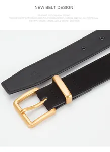 Detail of black leather belt with matte gold buckle and size engraving on white background