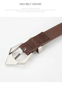 Detailed macro view of the brown leather belt featuring a sharp silver geometric buckle