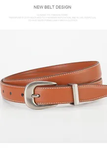 Detail of brown leather belt featuring white contrast stitching and brushed metal buckle