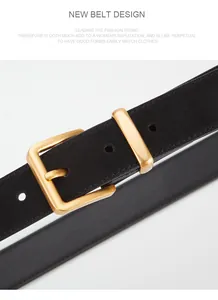 Macro detail of black leather belt with a vintage gold square metal buckle