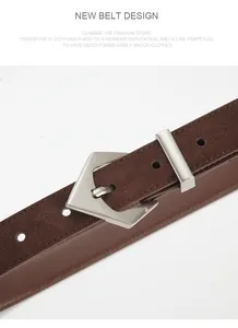 Detailed close-up of dark brown suede leather belt with unique silver pentagon buckle