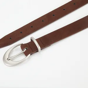 Brown frosted suede leather belt for women featuring a silver oval buckle on white background