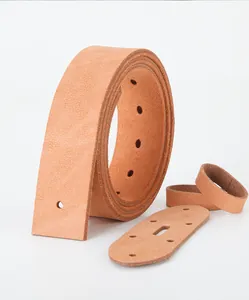 Detailed macro view of natural full grain cowhide leather belt strap with pre-punched holes