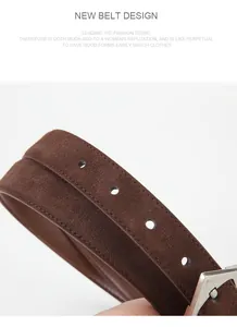 Macro shot of dark brown suede leather belt with fine stitching and silver buckle