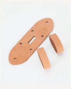 Detail of genuine cowhide leather strap parts with multiple holes and matching loops