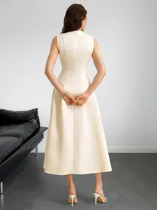 Rear view of an elegant sleeveless cream midi A-line dress showing back zipper detail