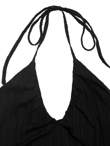 Detail of black rib-knit fabric and halter V-neckline with delicate tie-up straps
