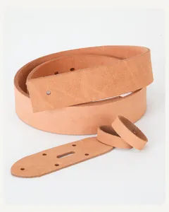 Macro view of DIY natural cowhide leather belt kit with pre-punched tail piece