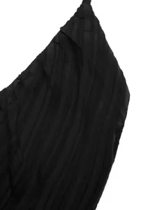 Detail of V-neck halter dress featuring black textured seersucker fabric and fine stitching