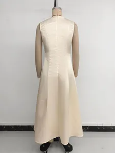 Detail view of the back of a sleeveless cream satin maxi dress with invisible zipper