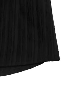 Detail of black V-neck summer dress featuring vertical striped texture and hem stitching