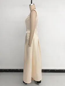 Detail view of beige sleeveless A-line maxi dress with side pocket and pleated satin fabric