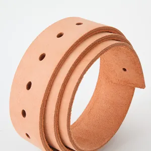 Natural vegetable tanned leather belt strap with pre-punched holes in a coiled display