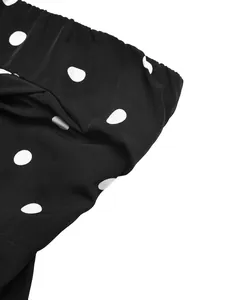Detail of vintage black and white polka dot fabric with elastic waistband texture