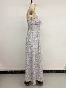 Detail view of purple floral maxi dress featuring a smocked bodice and bow tie detail