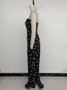 Side view of retro black and white polka dot strapless jumpsuit on a mannequin