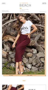 Detail of high waisted pleated wine red maxi skirt paired with a white graphic tee