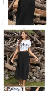Detail of high waisted black pleated maxi skirt with elastic waistband and fine texture