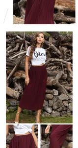 Detail shot of a high-waisted burgundy pleated skirt with elegant elastic waistband