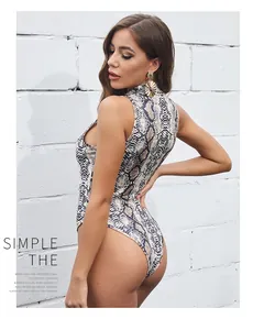 Close-up of sleeveless snakeskin bodysuit featuring high neck and side cut-out details