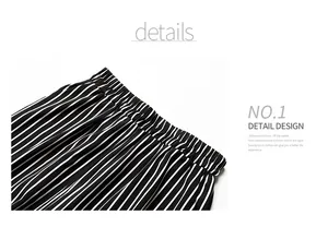Detailed macro view of the elastic waistband on black and white striped cropped pants