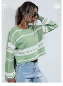 Detailed view of women's green and white striped knit long sleeve crop top