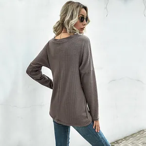 Women's brown waffle knit long sleeve top with irregular V-neck and relaxed fit design