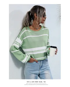 Detailed view of the exquisite binding collar on a green striped knitted sweater