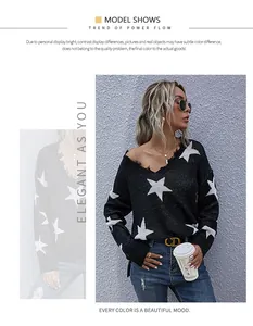 Detail of V-neck loose knit sweater with white star jacquard pattern and ribbed cuffs