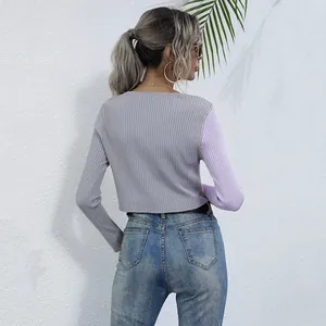 Back view of a slim-fit patchwork ribbed knit cardigan with grey body and lilac long sleeves