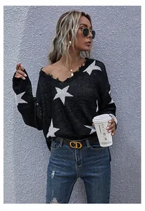 Detailed close-up of V-neckline with distressed frayed edges and white star pattern