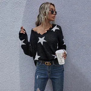 Women's V-neck oversized black knit sweater featuring white stars and frayed edges