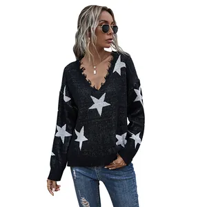 Women's V-neck knit sweater in black with white star patterns and fringe trim details