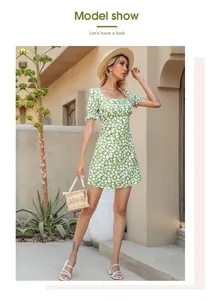 Detail of elegant green floral chiffon mini dress with puff sleeves for summer