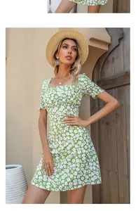 Detailed shot of elegant square neck floral chiffon summer dress with smocked sleeves